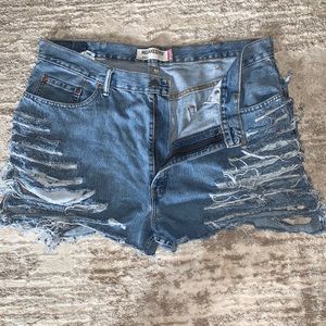 Destroyed LEVI denim jean shorts. 550